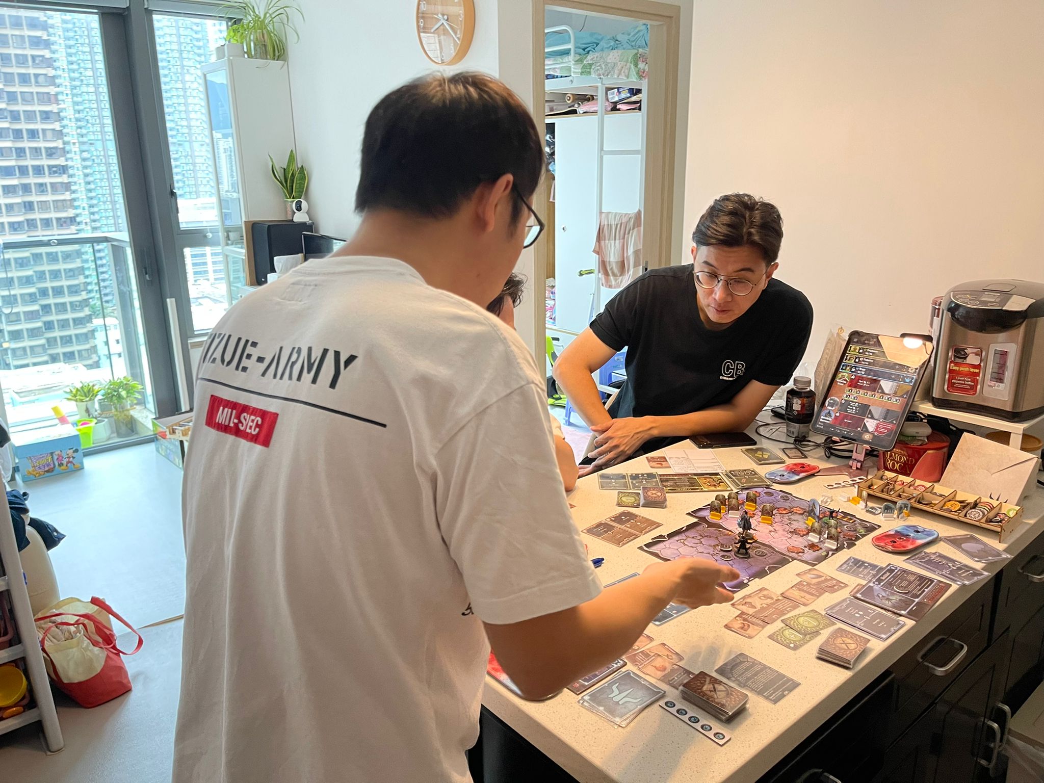 photo of me and my friend playing Gloomhaven